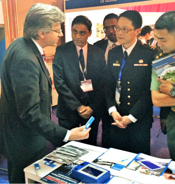 Mark Lawrence Johnson demonstrating diagnostic devices for Malaysian military officials